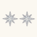 Sterling silver star-shaped stud earrings with brilliant moissanite center stones and pavé details on neutral background.