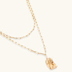 Layered paperclip chain necklace with organic flowing pendant made from eco-zinc alloy in warm gold finish